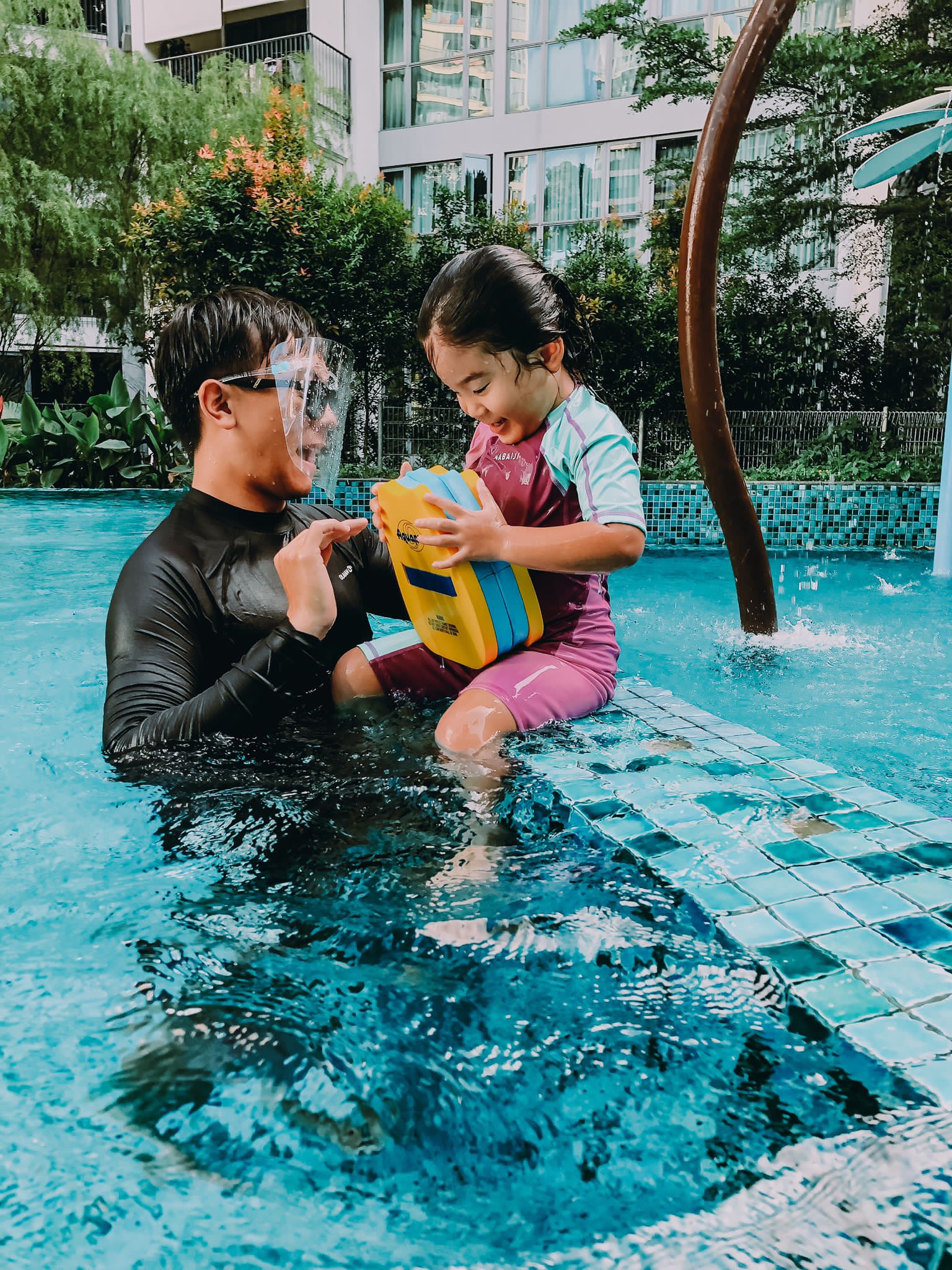 JustSwim coach supporting a child in the water