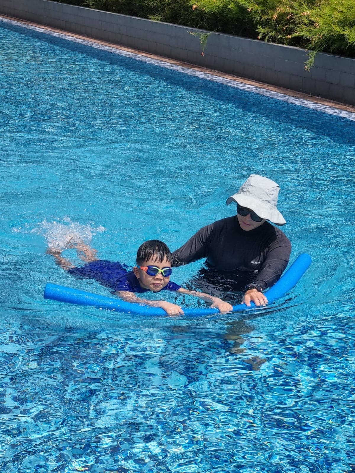 JustSwim coach giving poolside instruction